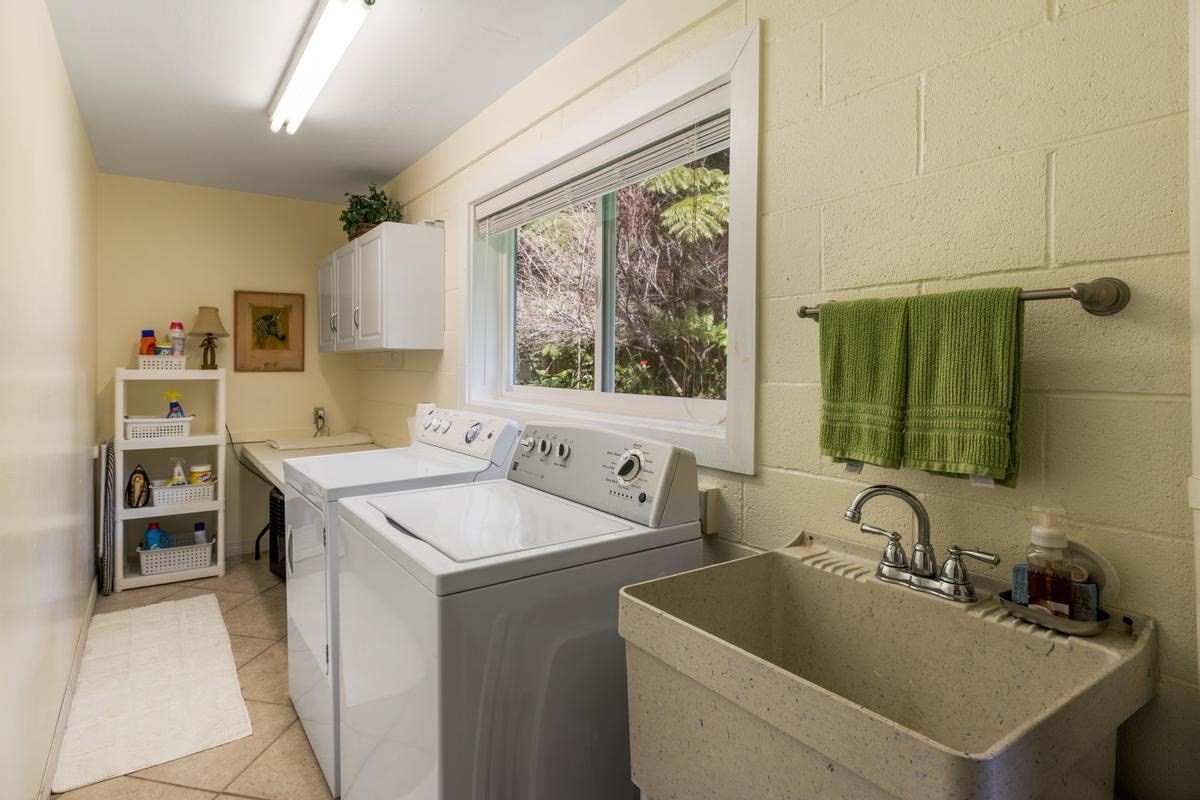 19-4252 Wright Road Volcano, HI 96785 - Photo 27 of 30 a room with a sink and a washer dryer