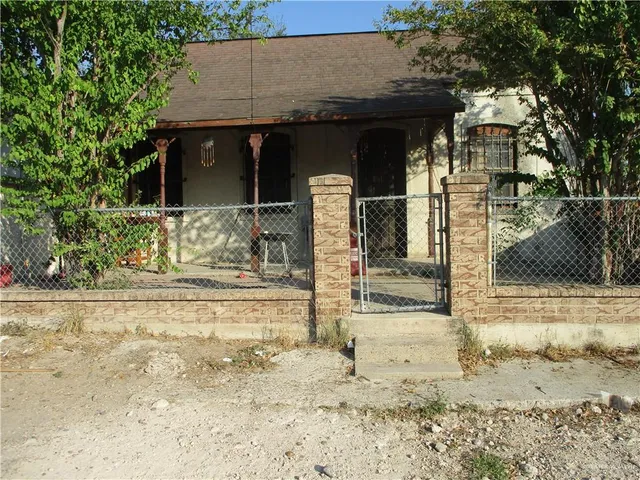 a view of a house with snow on the road