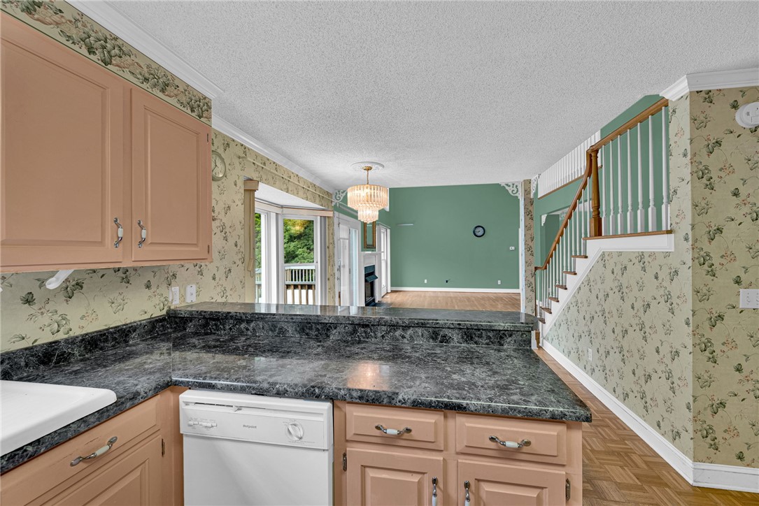 1016 Campbell Road Belton, SC 29627 - Photo 14 of 50 A classic kitchen with ample counter space and a convenient breakfast bar overlooks the inviting living area and access to the exterior.