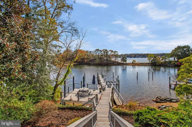 a view of a lake with a house and outdoor space