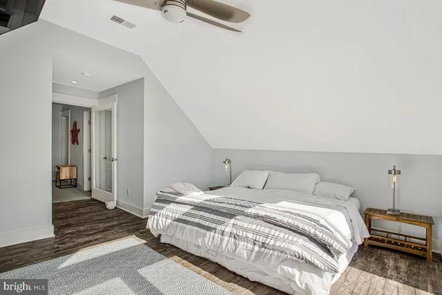 a bedroom with a bed and a walk in closet