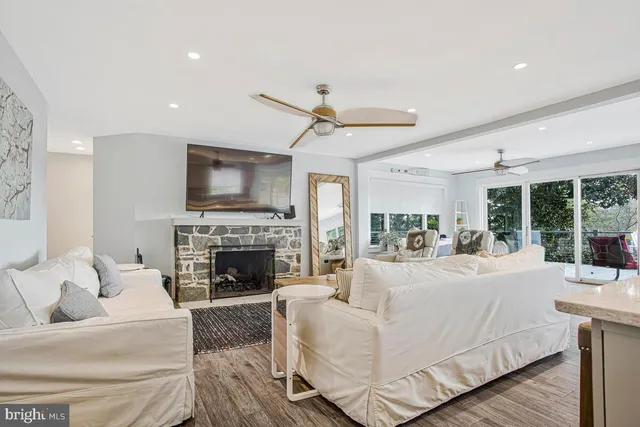 a living room with furniture fireplace and flat screen tv