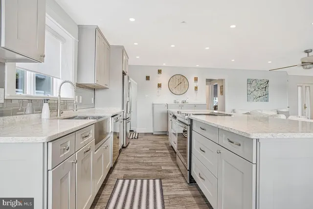 a large kitchen with a lot of counter space and a sink