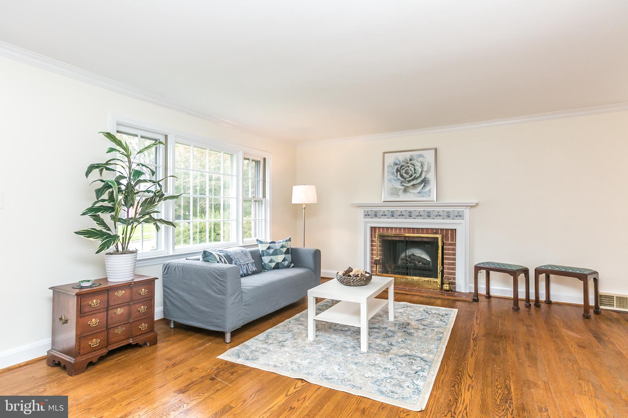 611 Piccadilly Road Baltimore, MD 21204 - Photo 2 of 41 Living room features a wood burning fireplace
