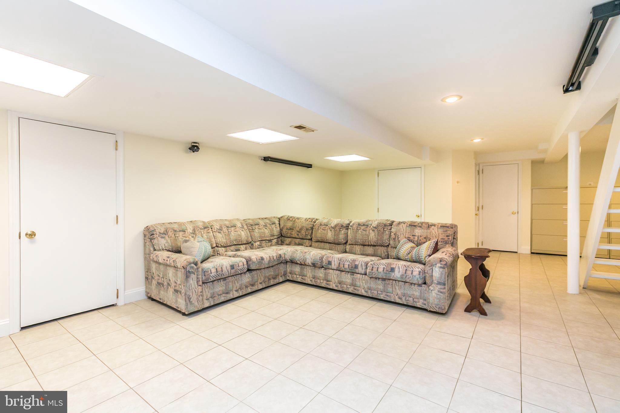 611 Piccadilly Road Baltimore, MD 21204 - Photo 30 of 41 Rec room with ceramic tile floor