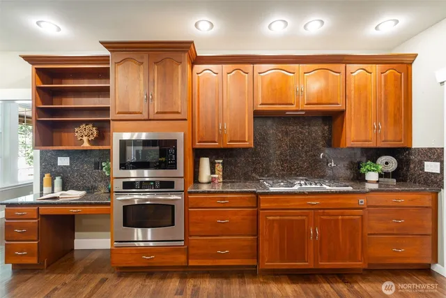 a spacious bedroom with a large bed and a large window