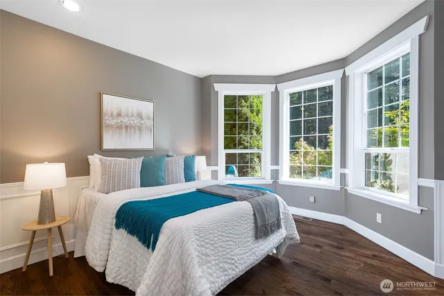 a living room with furniture a window and a table
