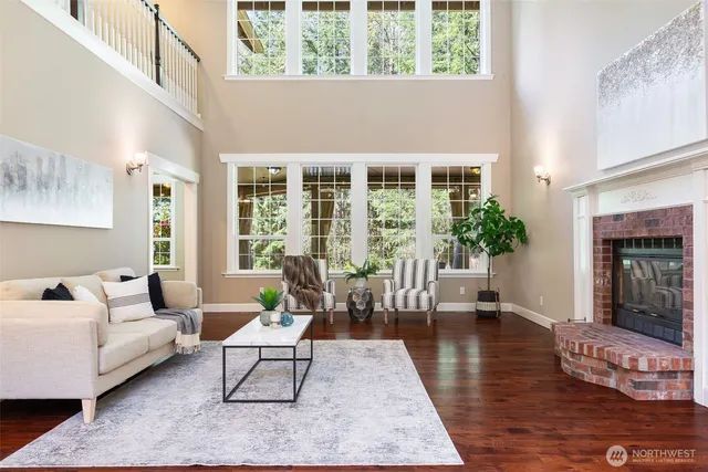 a view of a dining room with furniture wooden floor and chandelier