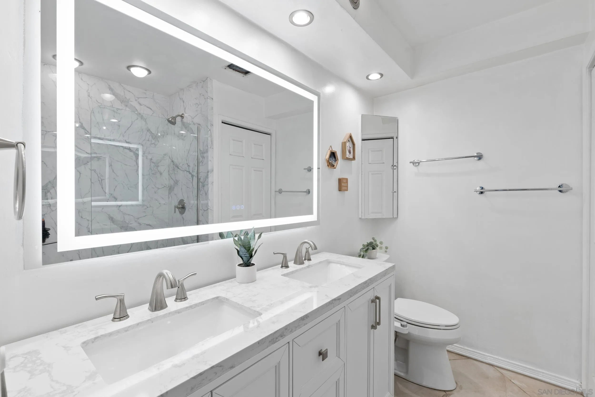 5810 Riley Street, Unit 8 San Diego, CA 92110 - Photo 16 of 20 Newly renovated bathroom with in-unit washer & dryer