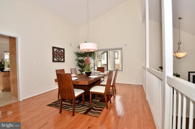 7307 Hooking Road McLean, VA 22101 - Photo 15 of 29 a view of a dining room with furniture and a chandelier