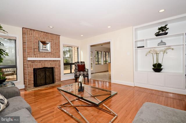 7307 Hooking Road McLean, VA 22101 - Photo 16 of 29 a living room with furniture and a fireplace