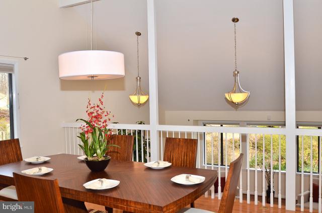 7307 Hooking Road McLean, VA 22101 - Photo 23 of 29 a view of a dining room with furniture and wooden floor