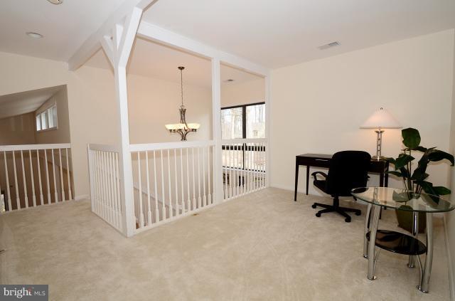 7307 Hooking Road McLean, VA 22101 - Photo 24 of 29 a view of a workspace with furniture and a window