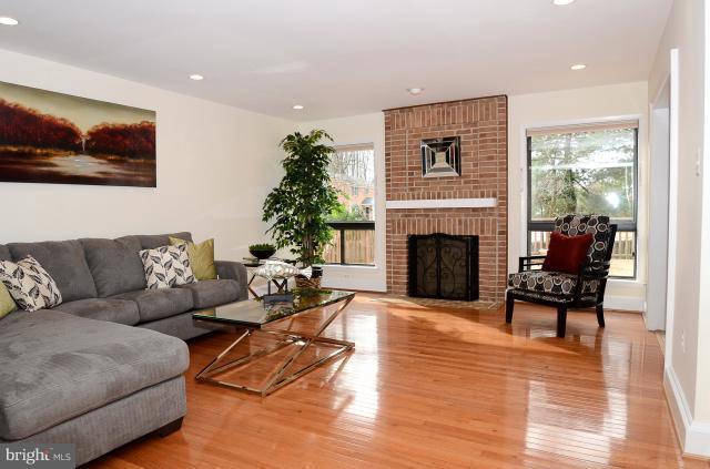 7307 Hooking Road McLean, VA 22101 - Photo 26 of 29 a living room with furniture and a fireplace