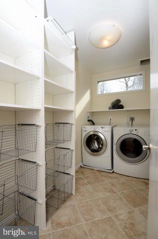 7307 Hooking Road McLean, VA 22101 - Photo 8 of 29 a utility room with dryer and washer