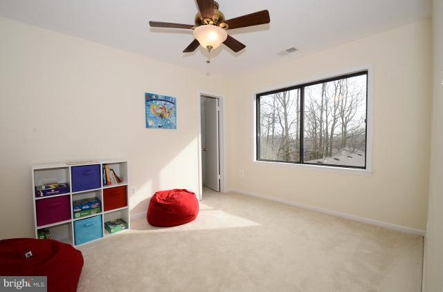 7307 Hooking Road McLean, VA 22101 - Photo 9 of 29 a bedroom with a bed and a window