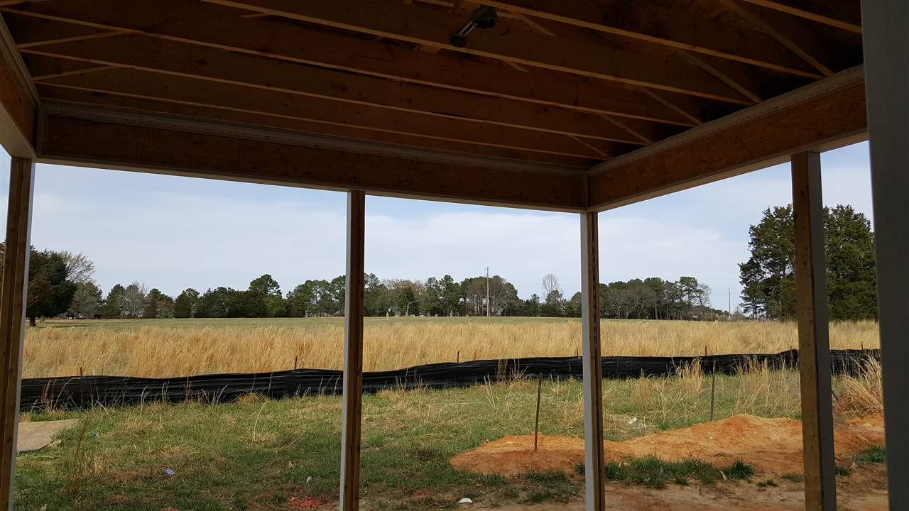 420 Seabring Lane Raleigh, NC 27603 - Photo 11 of 19 Covered back patio with ceiling fan prewire! (please note property extends back farther than black silk fence line) Patio/Deck