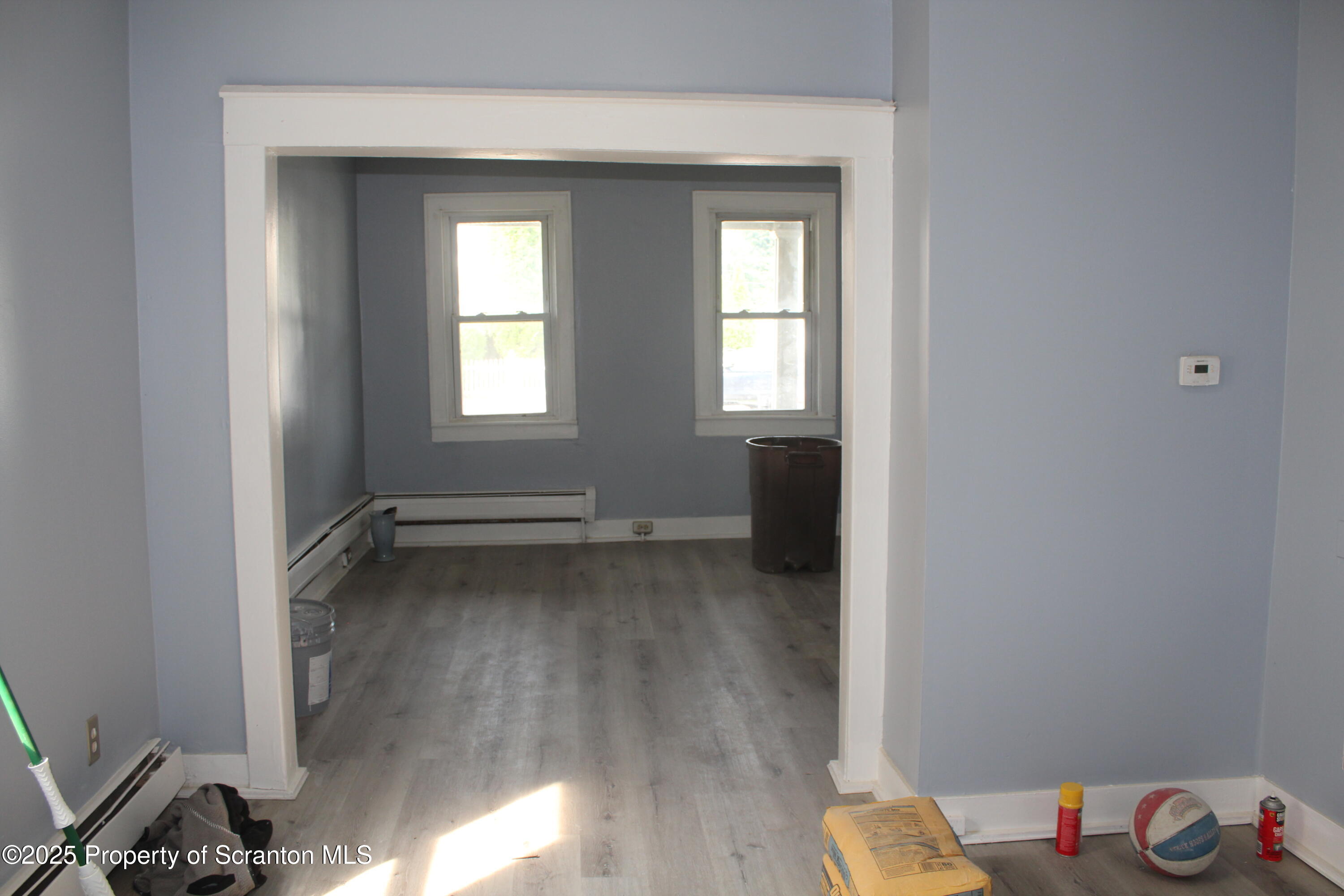 1507 Luzerne Street Scranton, PA 18504 - Photo 8 of 26 a view of a room with wooden floor and a window