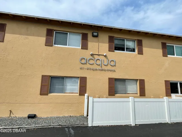 a front view of a house with garage