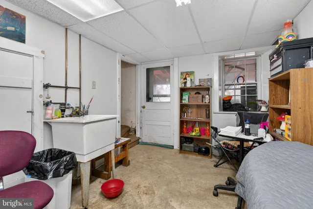 a bathroom with a sink toilet and mirror