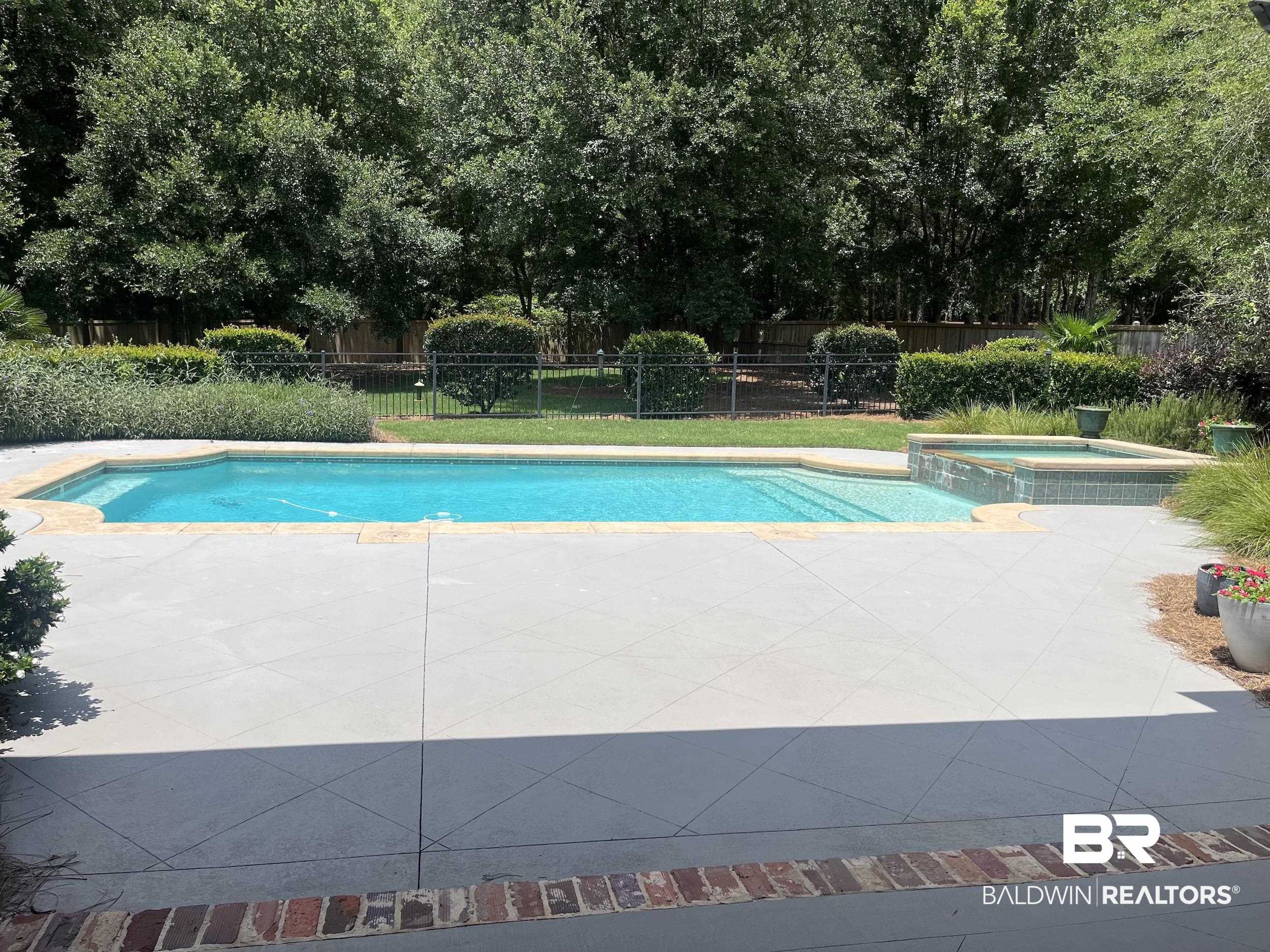 565 Falling Water Boulevard Fairhope, AL 36532 - Photo 5 of 27 View of swimming pool featuring a patio area and an in ground hot tub