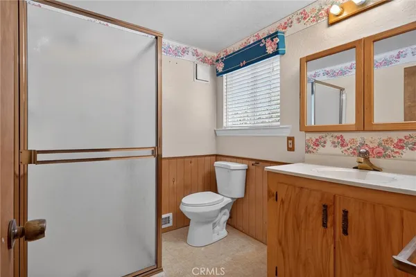 a view of empty room with wooden ceiling