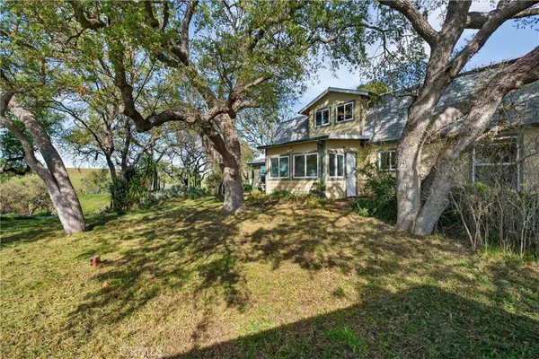 a view of a large body of water with a building in the background
