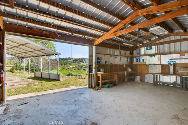 an aerial view of residential houses with outdoor space and ocean view