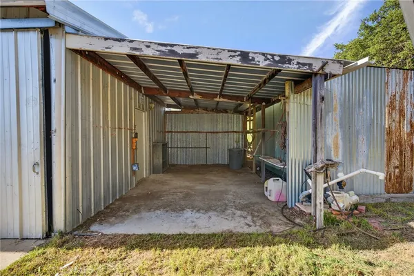an aerial view of a house with a yard basket ball court and outdoor seating