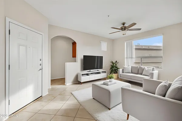 a living room with furniture and a flat screen tv