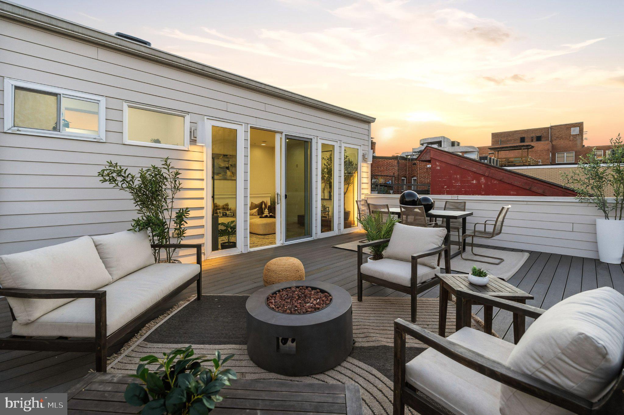 1837 Kalorama Road Northwest, Unit F Washington, DC 20009 - Photo 33 of 42 Charming rooftop retreat at sunset.