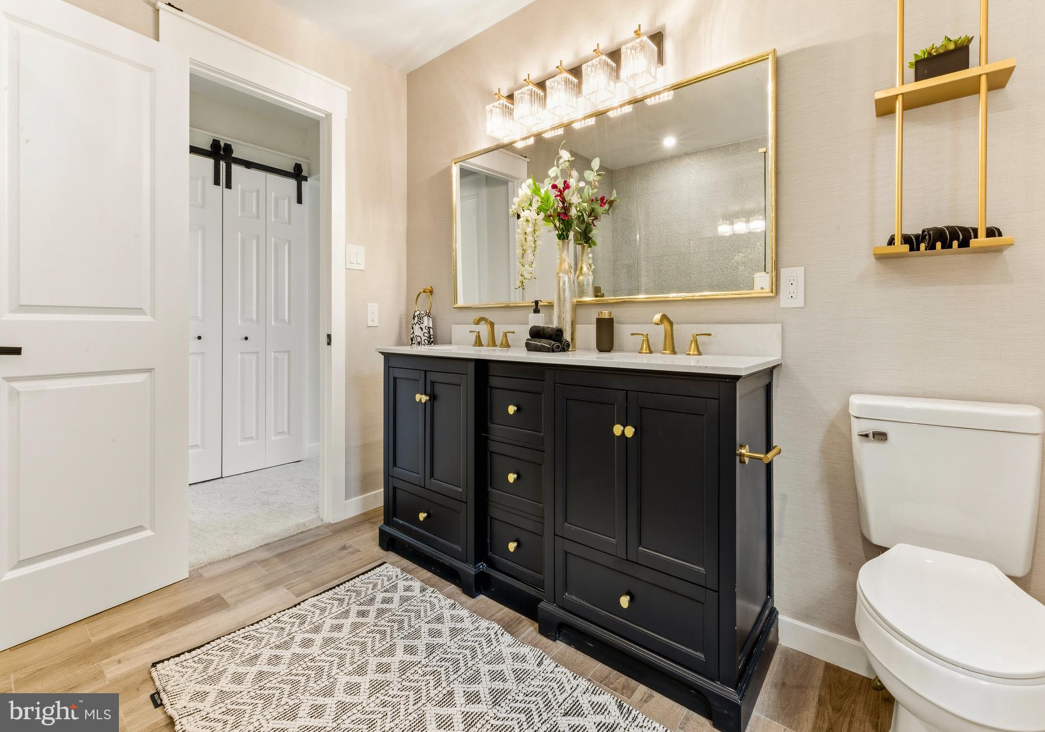 8 Michele Court Sewell, NJ 08080 - Photo 18 of 29 a bathroom with a toilet a sink and mirror