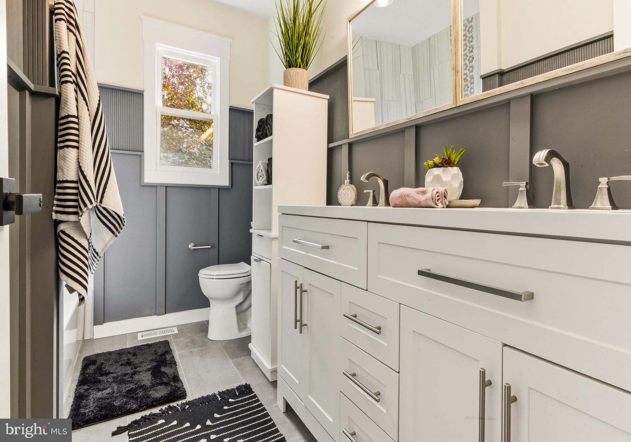 8 Michele Court Sewell, NJ 08080 - Photo 24 of 29 a bathroom with a sink a toilet and a mirror