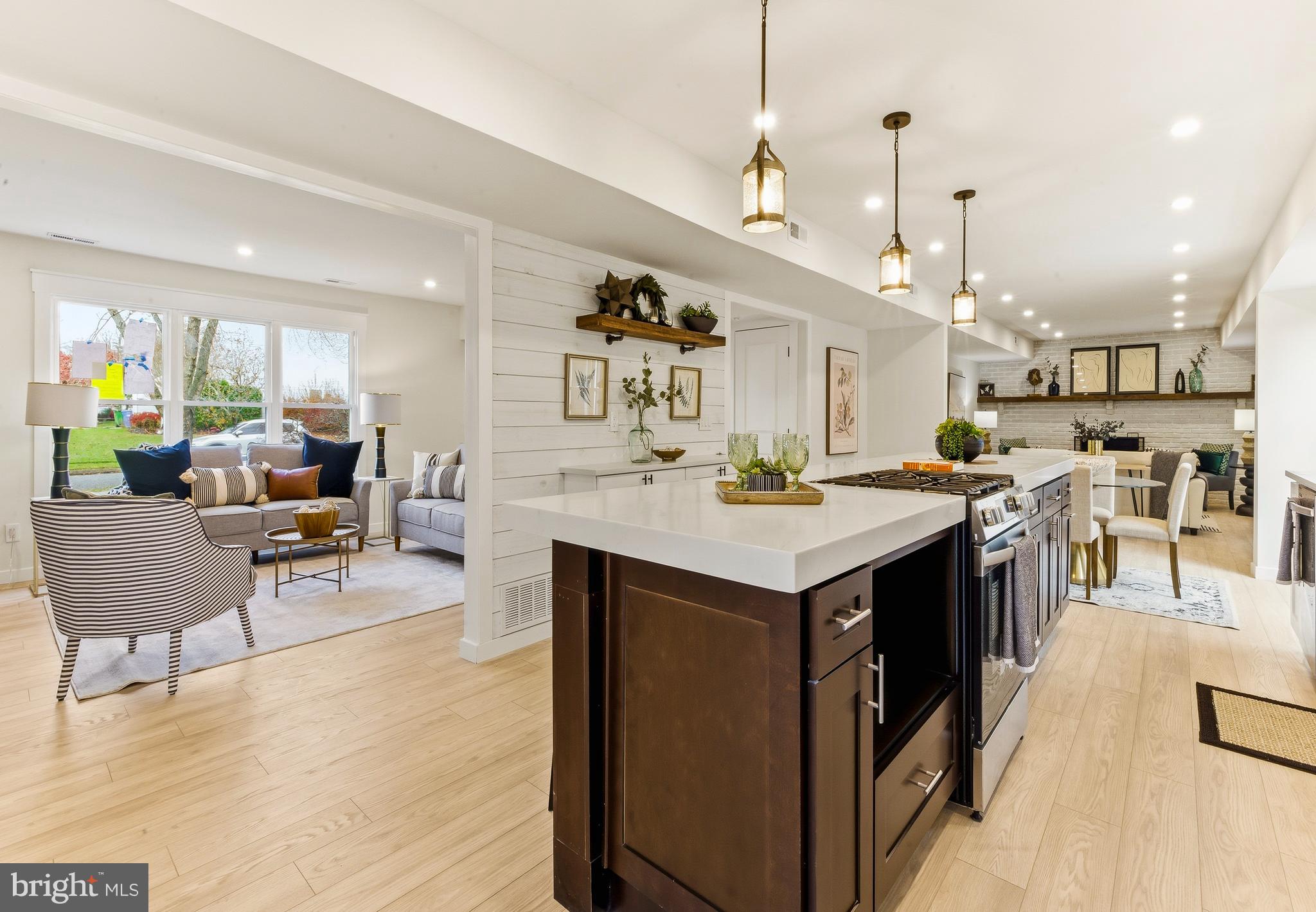 8 Michele Court Sewell, NJ 08080 - Photo 10 of 29 a living room with stainless steel appliances kitchen island a table chairs and a living room