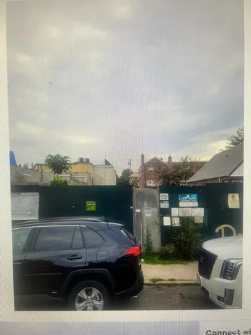 a view of a cars park in front of building