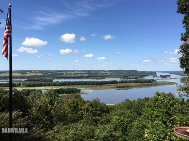 8634 Fisher Road Hanover, IL 61041 - Photo 3 of 25 a view of a lake from a yard