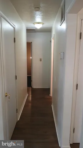 a white toilet sitting next to a white sink