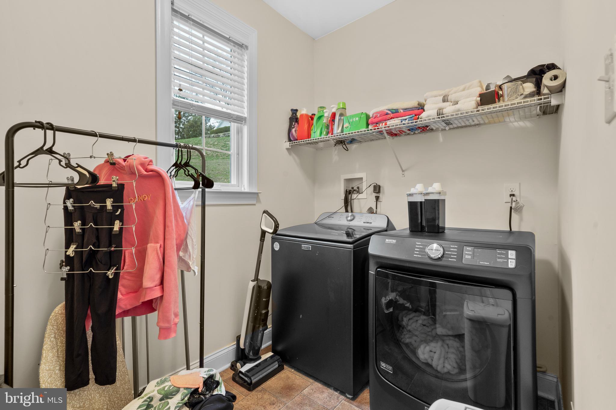 776 Barry Drive Springfield, PA 19064 - Photo 18 of 44 a utility room with dryer washer and other items