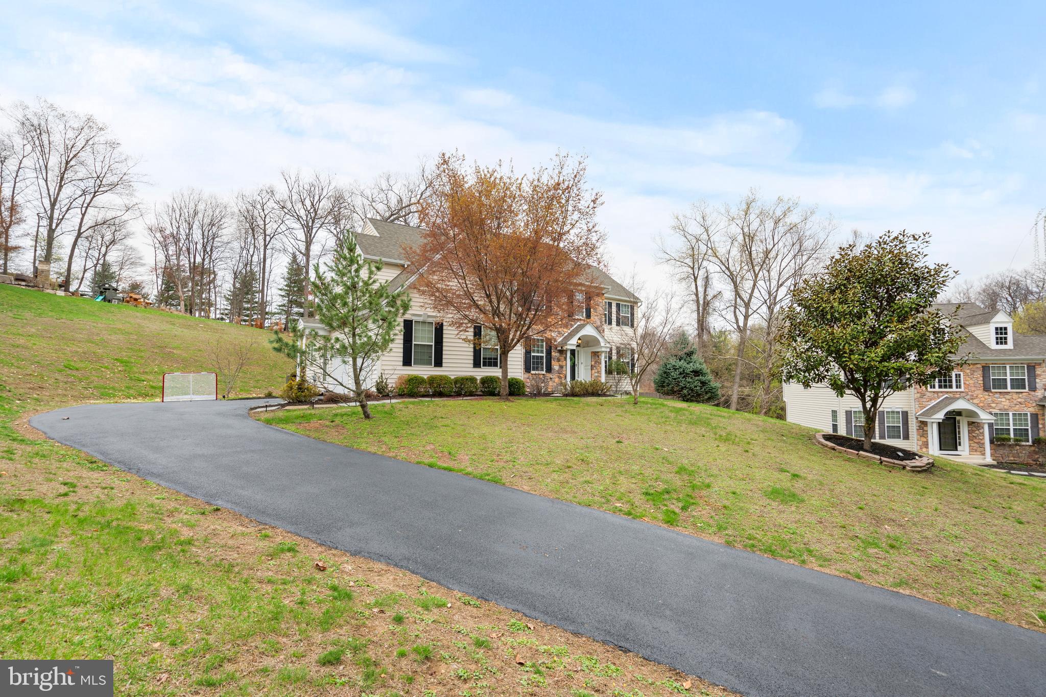 776 Barry Drive Springfield, PA 19064 - Photo 2 of 44 a view of yard with swimming pool and trees in the background