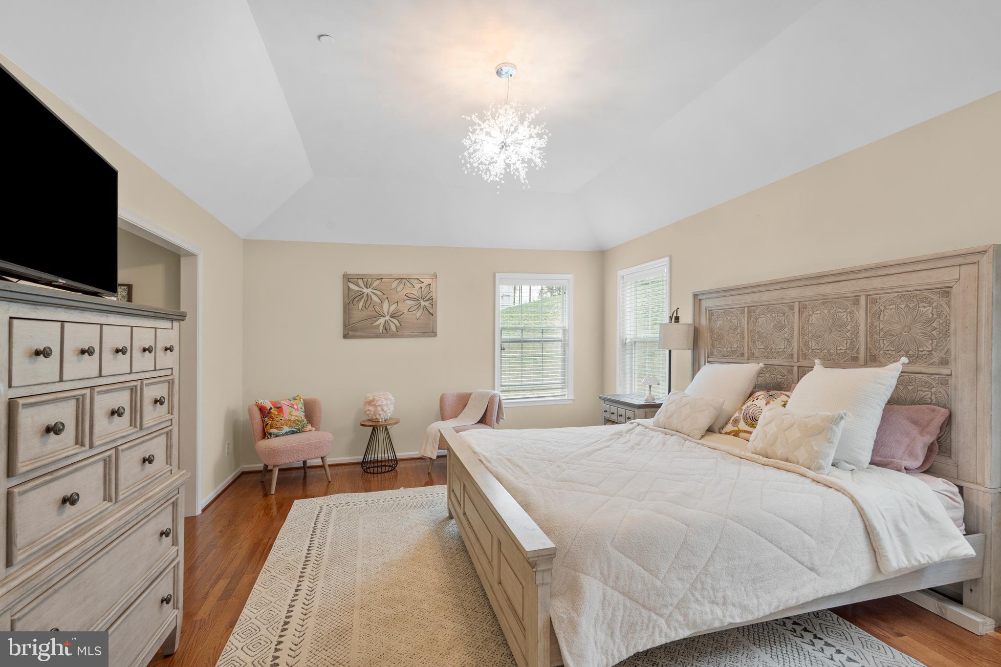 776 Barry Drive Springfield, PA 19064 - Photo 22 of 44 a bedroom with a bed and flat screen tv