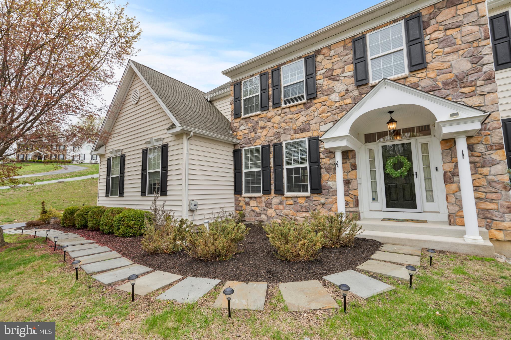 776 Barry Drive Springfield, PA 19064 - Photo 3 of 44 a front view of a house with garden