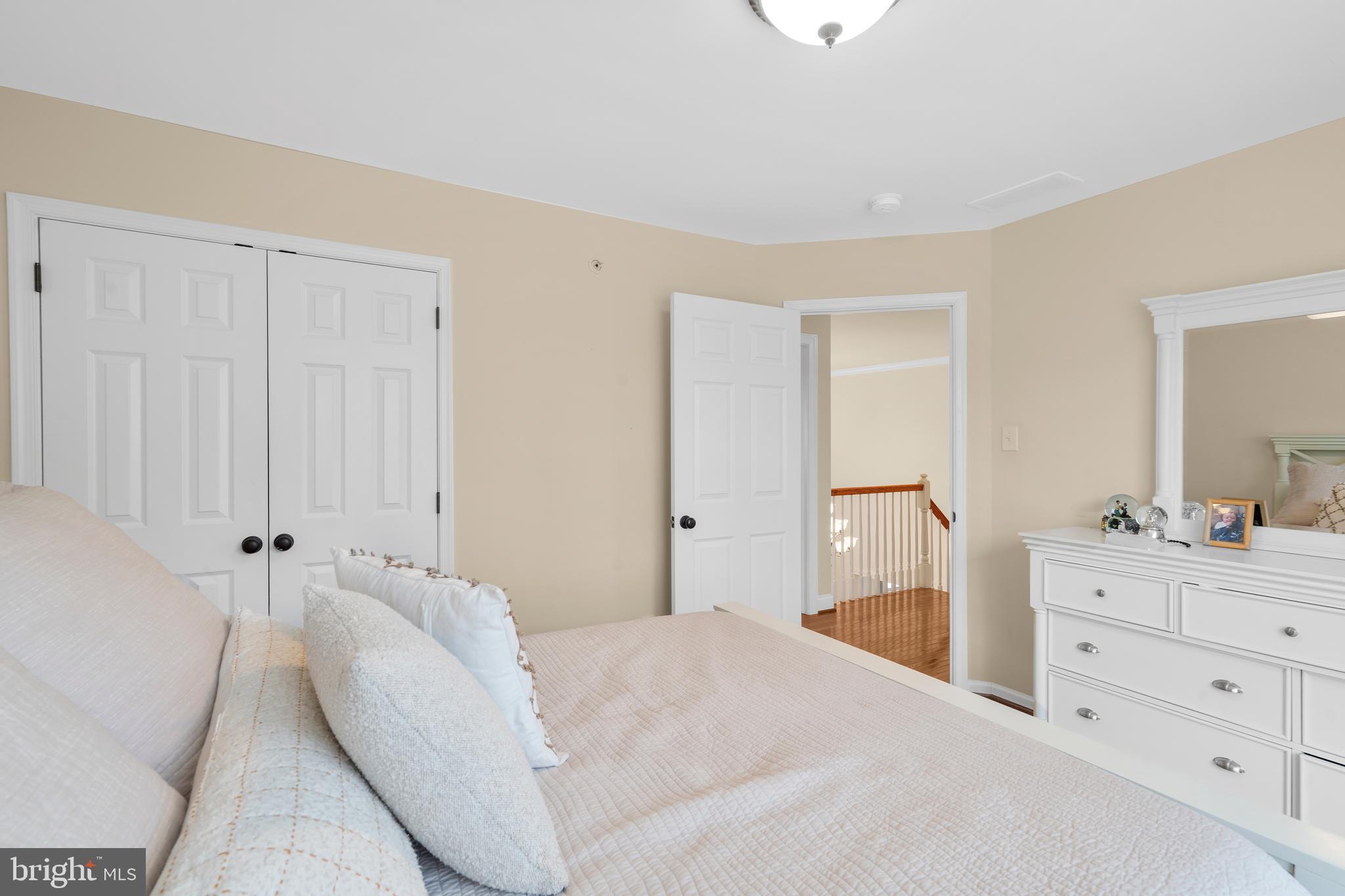 776 Barry Drive Springfield, PA 19064 - Photo 31 of 44 a spacious bedroom with a bed and a dresser