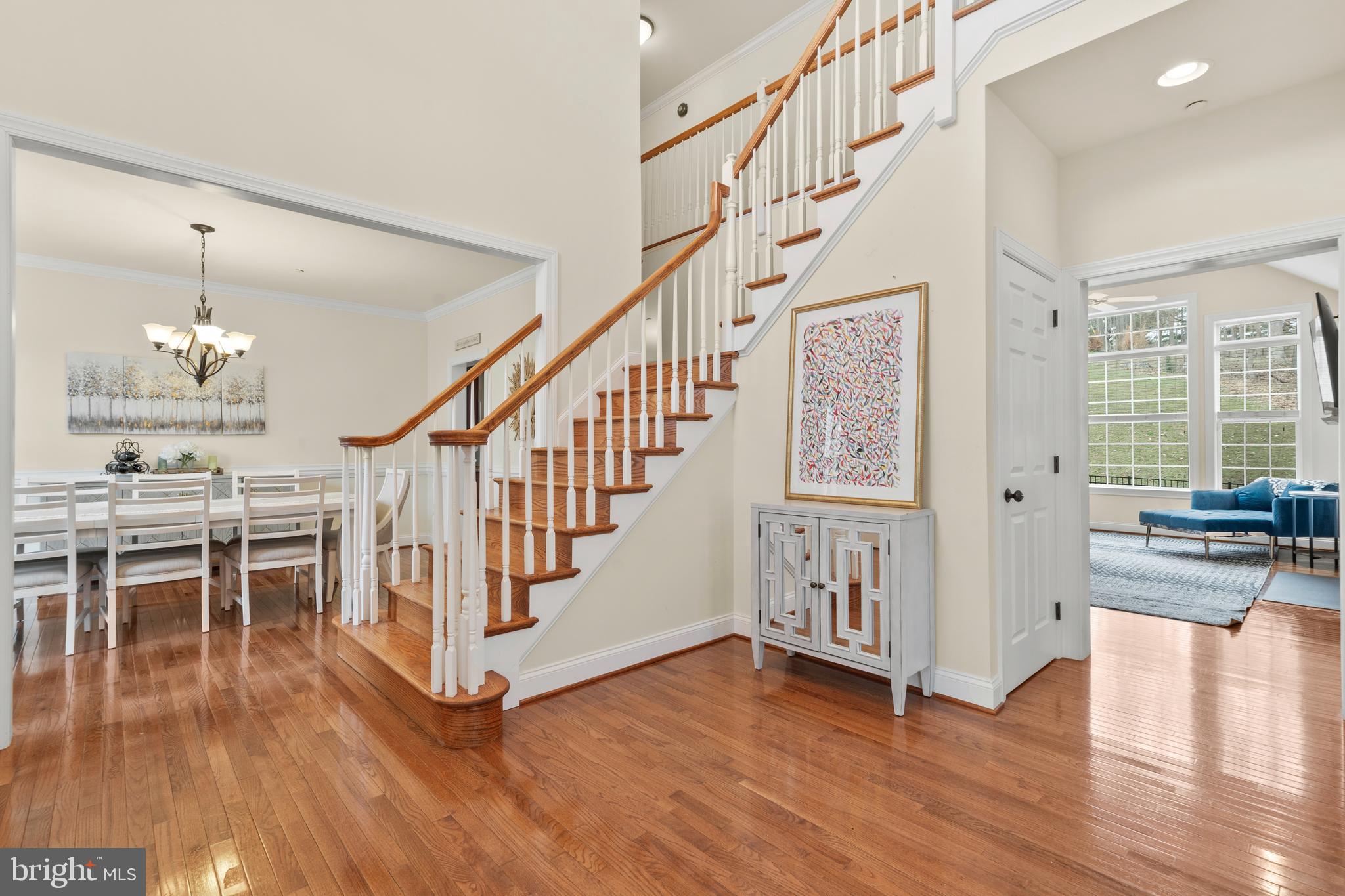 776 Barry Drive Springfield, PA 19064 - Photo 5 of 44 a view of a hallway with wooden floor and staircase