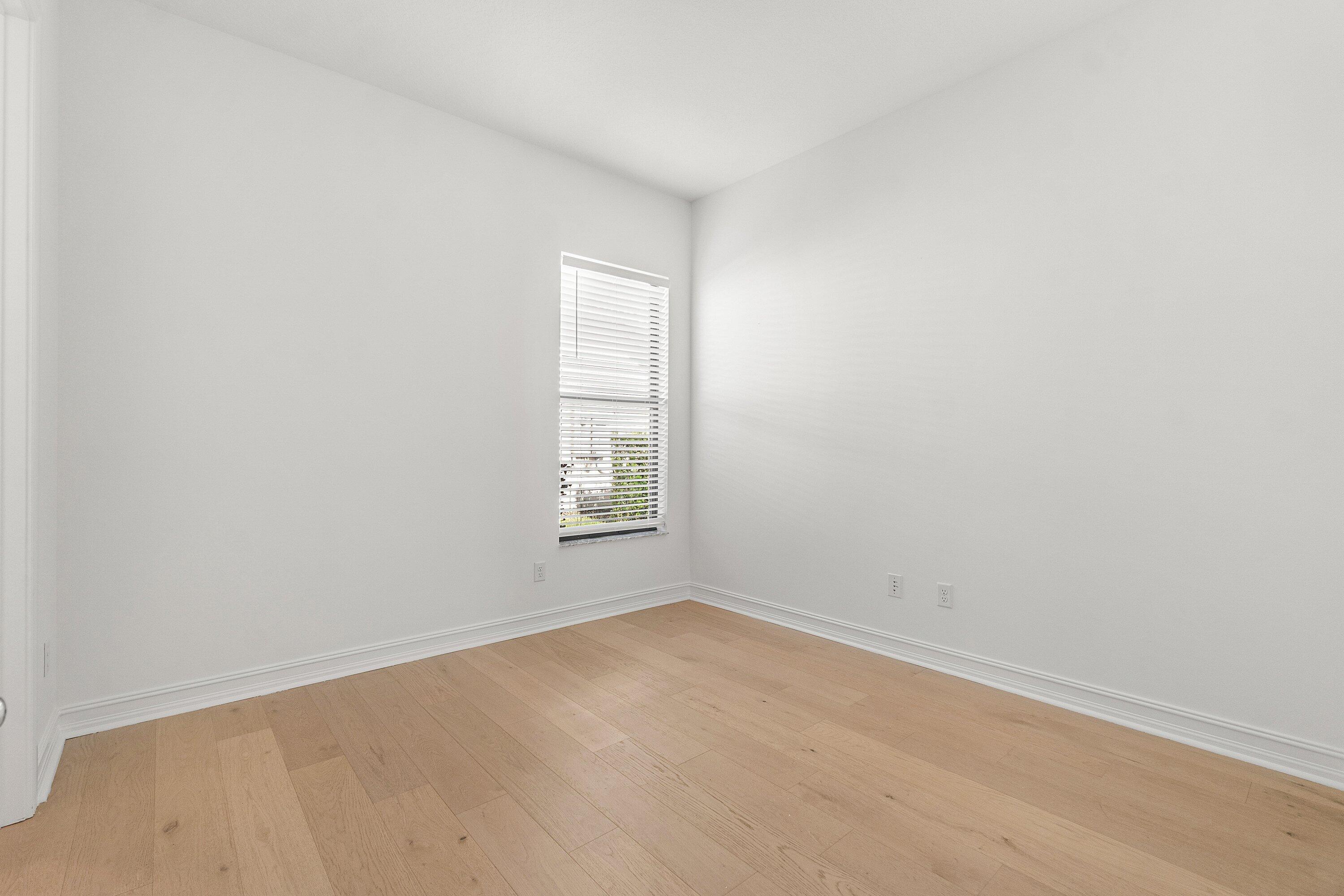 11902 Palermo Road Parkland, FL 33076 - Photo 22 of 48 an empty room with a window