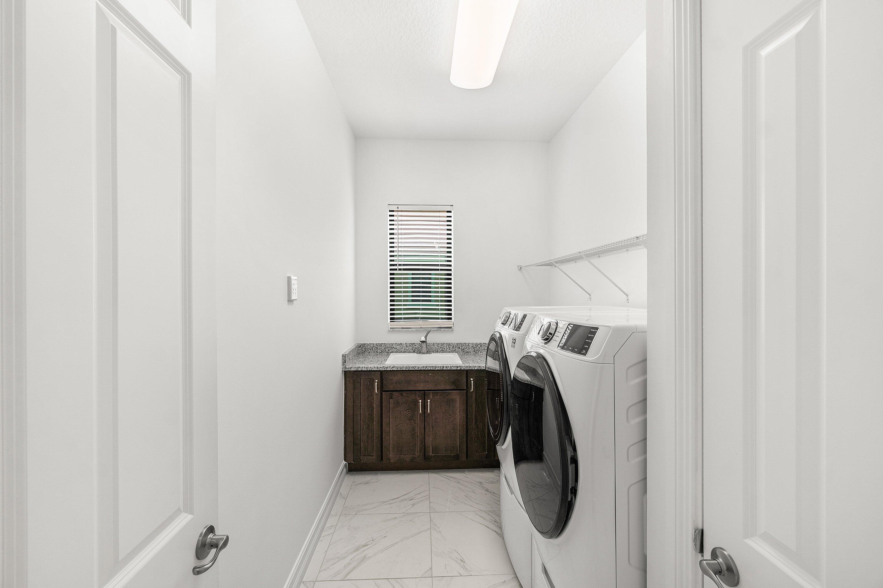 11902 Palermo Road Parkland, FL 33076 - Photo 27 of 48 a utility room with dryer and washer