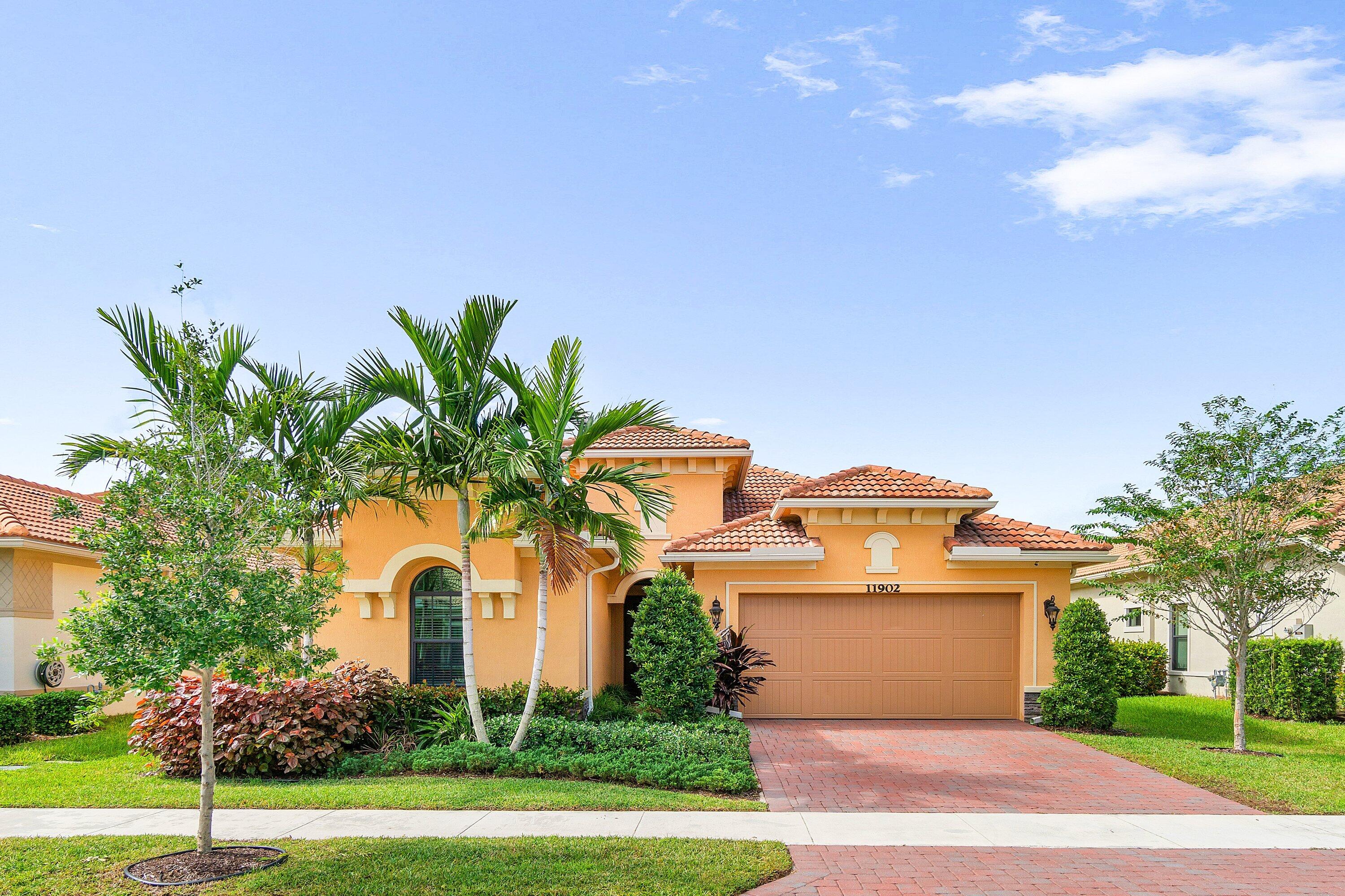 11902 Palermo Road Parkland, FL 33076 - Photo 39 of 48 a front view of a house with a yard and garage