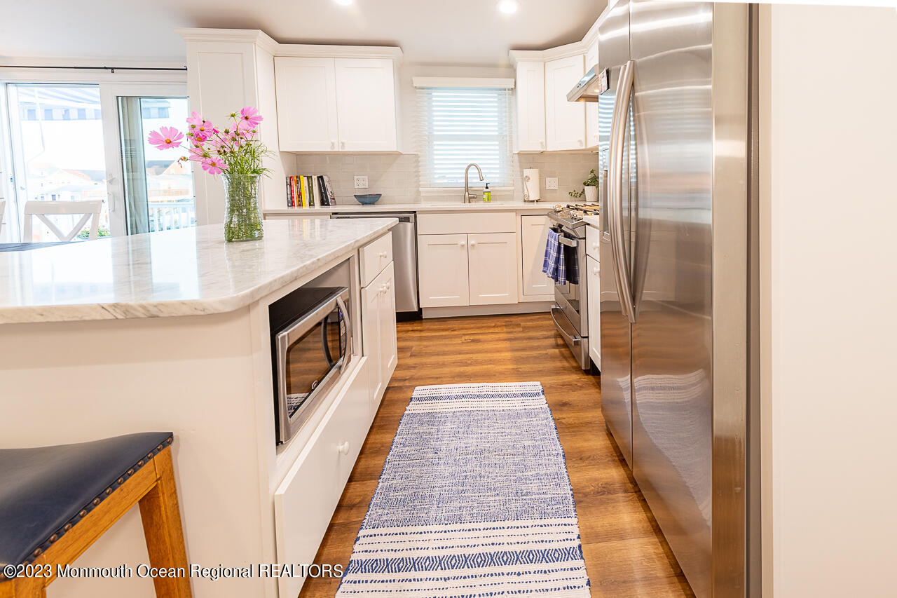 337 Kingfisher Road Tuckerton, NJ 08087 - Photo 14 of 41 a kitchen with stainless steel appliances granite countertop a refrigerator and a stove