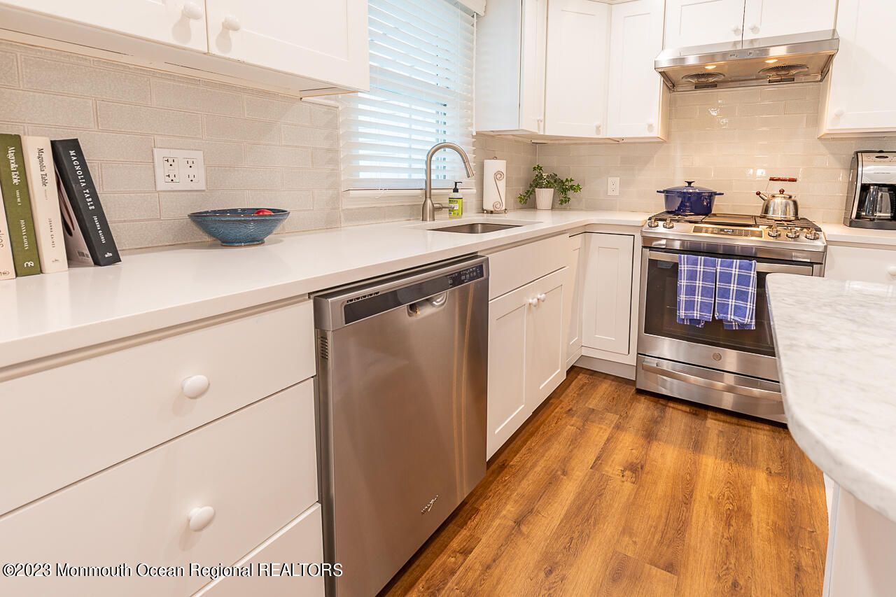 337 Kingfisher Road Tuckerton, NJ 08087 - Photo 15 of 41 a kitchen with a sink a stove and cabinets
