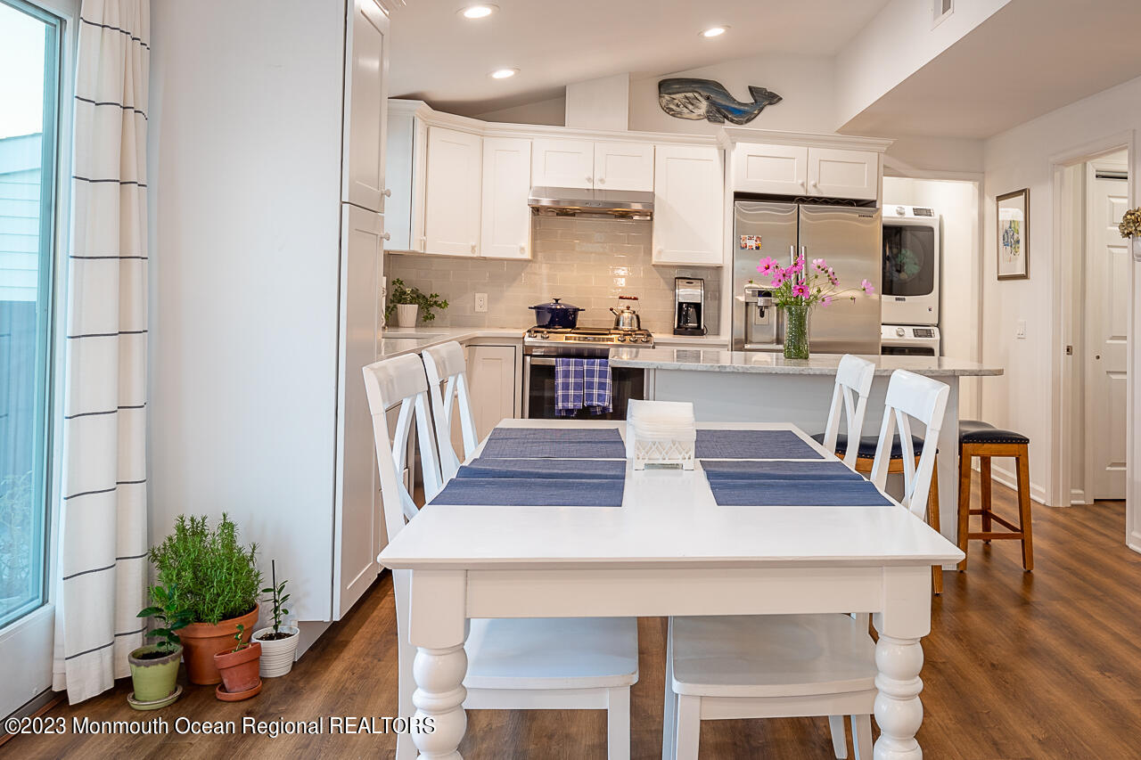 337 Kingfisher Road Tuckerton, NJ 08087 - Photo 7 of 41 a kitchen with a table chairs refrigerator and microwave