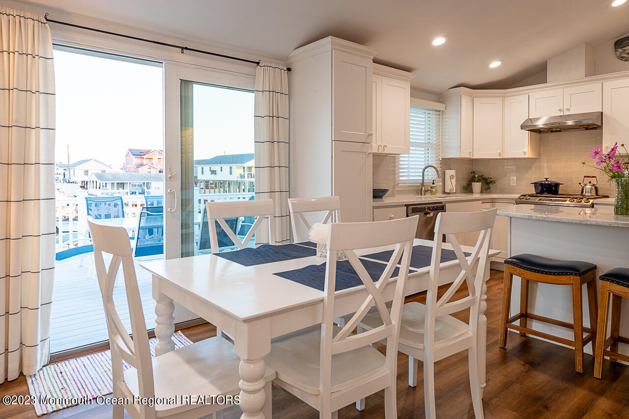 337 Kingfisher Road Tuckerton, NJ 08087 - Photo 8 of 41 a view of a dining room with furniture window and wooden floor